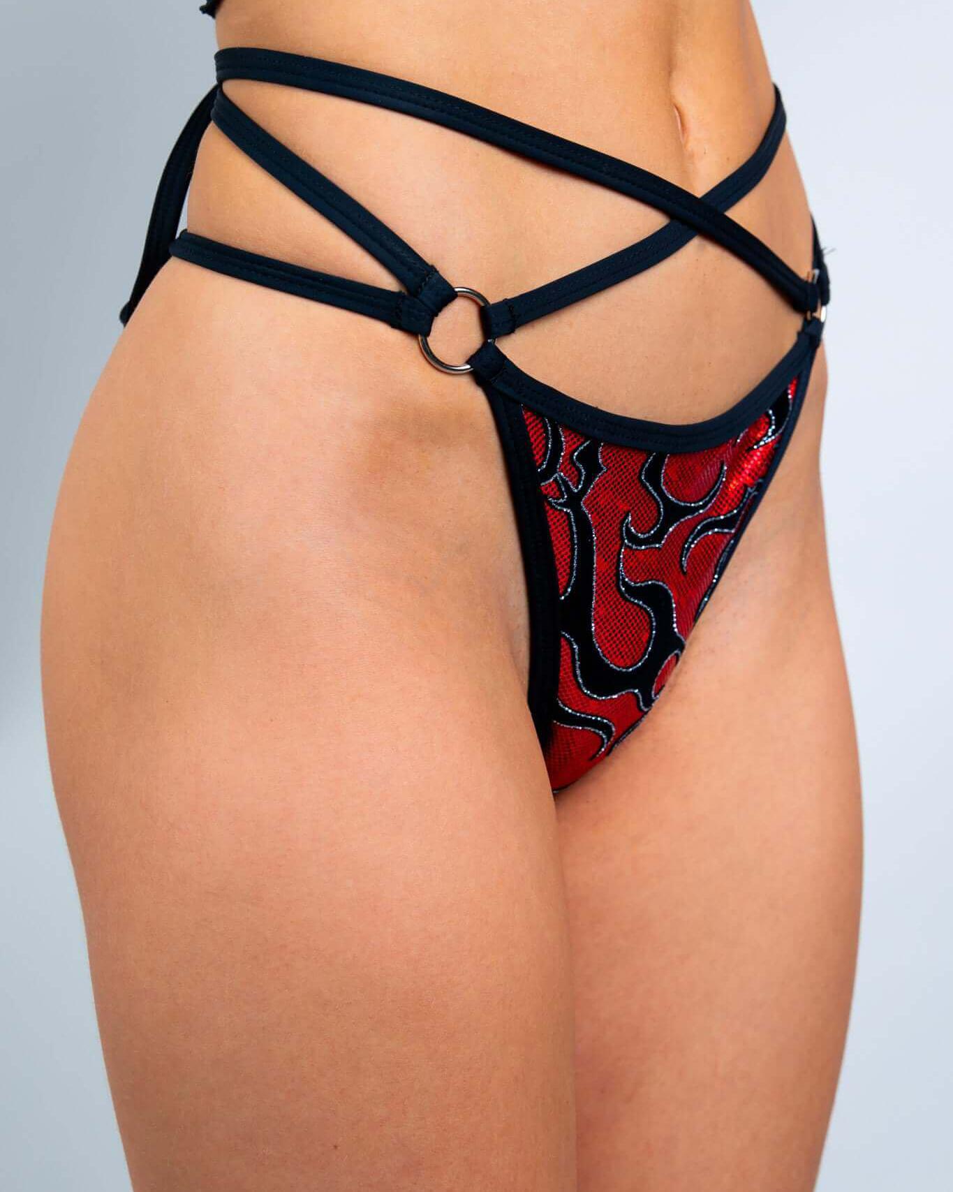 Side view of Inferno Expose Bottoms featuring strappy design and o-ring detail, perfect for rave outfits.