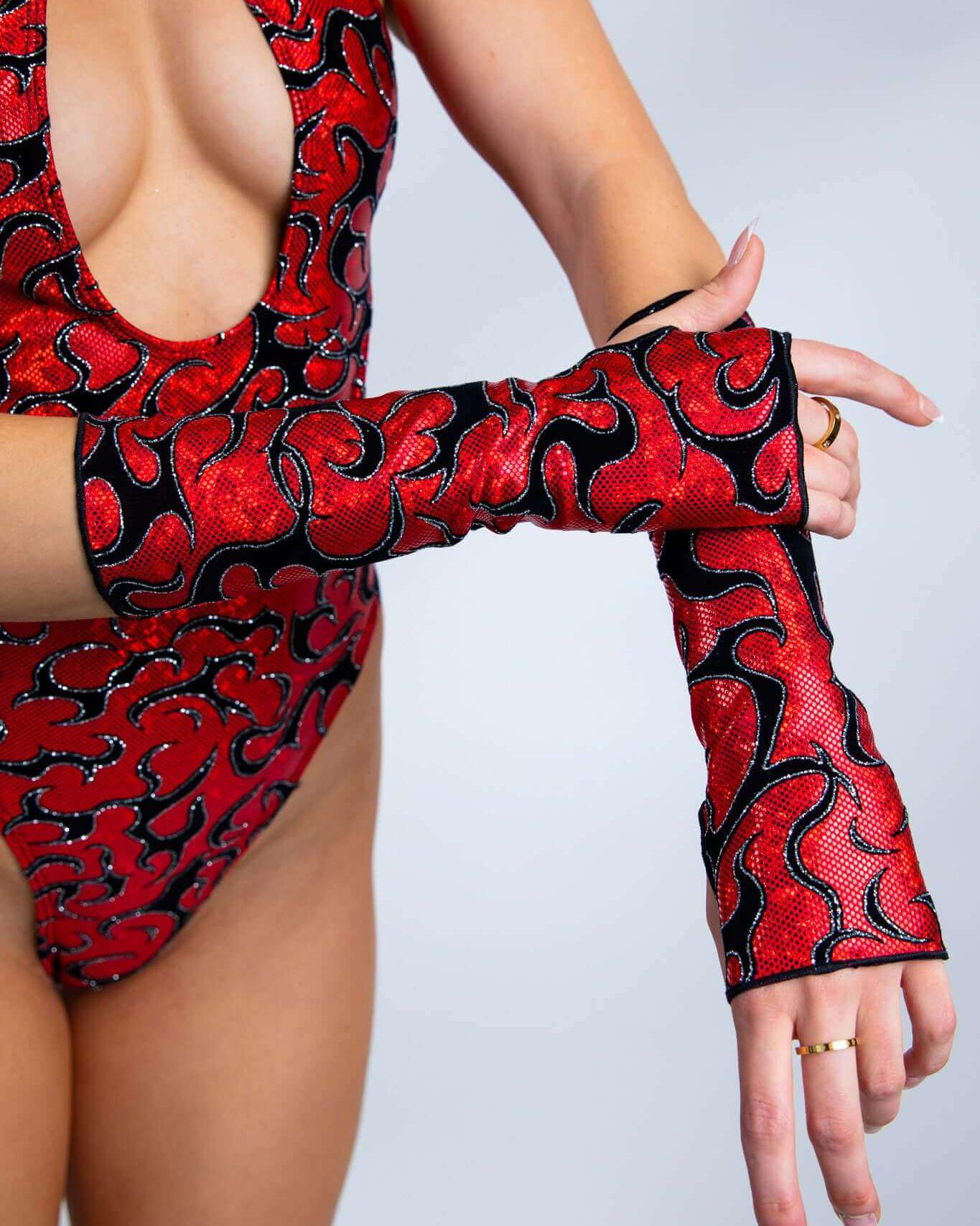 Inferno Gloves in red flame design, ideal for rave outfits, showcasing stylish arm coverage and hand openings.