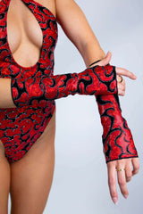 Freedom Rave Wear Inferno gloves in red with bold black patterns add vibrant style to rave outfits. Perfect for making a unique statement.