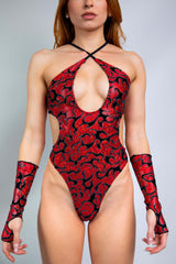 Freedom Rave Wear Inferno gloves and bodysuit in red with bold black patterns add vibrant style to rave outfits. Perfect for standing out.