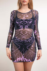 An up close photo of a girl wearing a short, fitted mesh dress with long sleeves. She is wearing a black bikini under the dress. The dress is black with purple tattoo inspired designs on it.