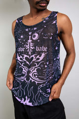 An up close photo of a man wearing a black mesh tank top with purple tattoo-like designs.