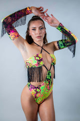 Colorful model showcasing Intensity Arm Sleeves with Fringe, perfect for rave outfits and festival fashion.