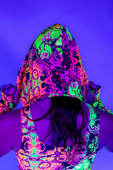 Reversible Intensity Assassin Hood featuring vibrant trippy UV print, perfect for rave outfits.