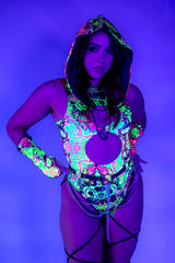 Model in vibrant UV reactive Intensity Keyhole Bodysuit with leg straps, perfect for rave outfits.