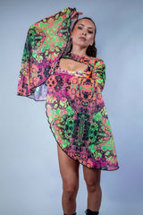 Model showcasing vibrant Intensity Mesh Bell Sleeves, perfect for stylish rave outfits with flowy design.