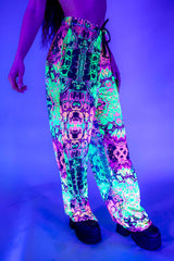 Funky rainbow mesh rave pants with a loose fit and UV-reactive design, perfect for festivals and dance events.