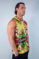 Model wearing a vibrant, neon-patterned Intensity men's tank top with hood, perfect for rave outfits.