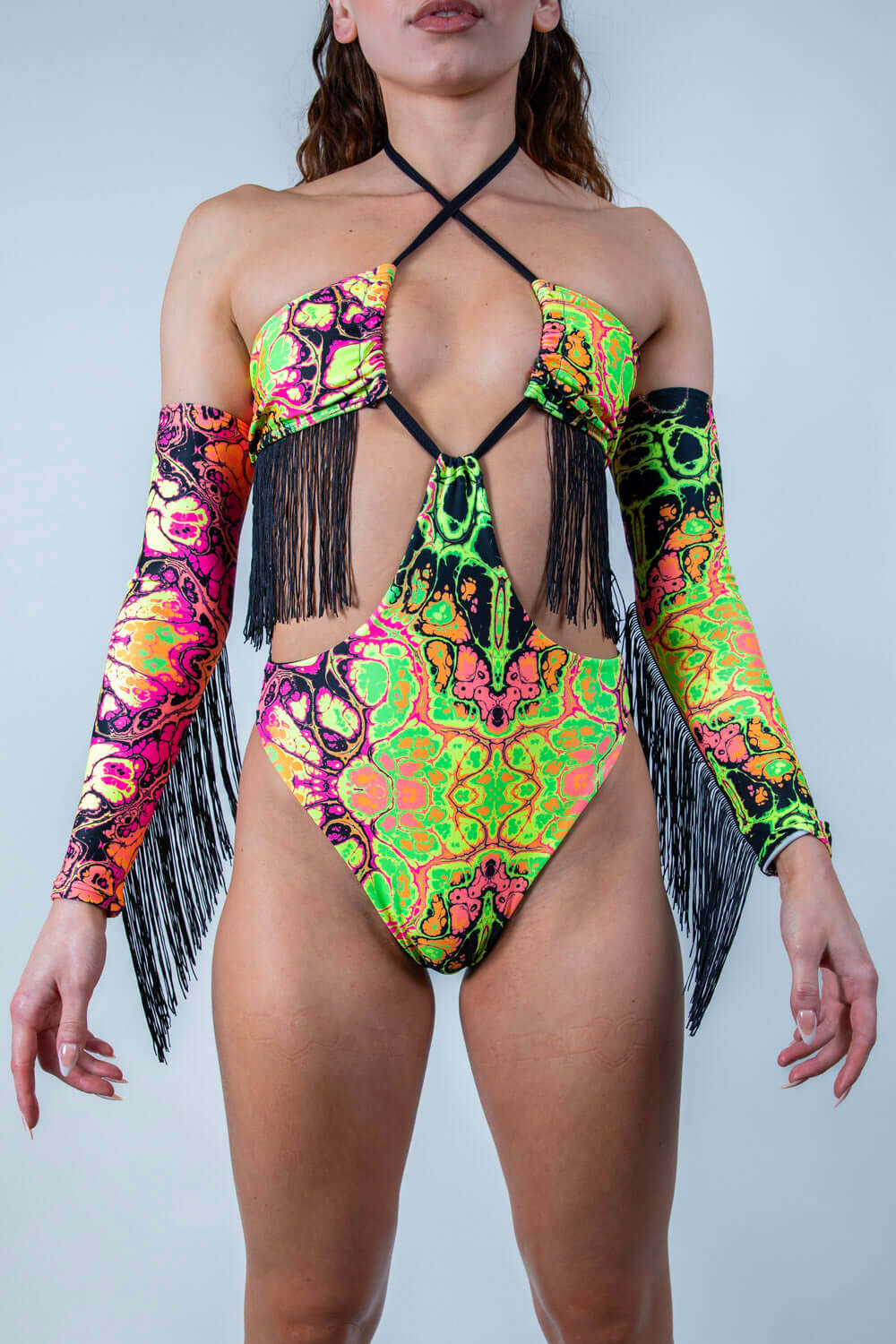 Intensity Twist Bodysuit with Fringe in vibrant UV colors, perfect for rave outfits, featuring a twist top and cheeky design.