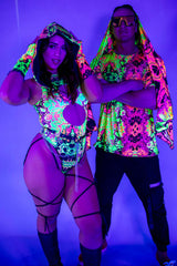 Stylish rave outfits in neon colors, featuring a woman in a cut-out bodysuit and a man in a vibrant hoodie.