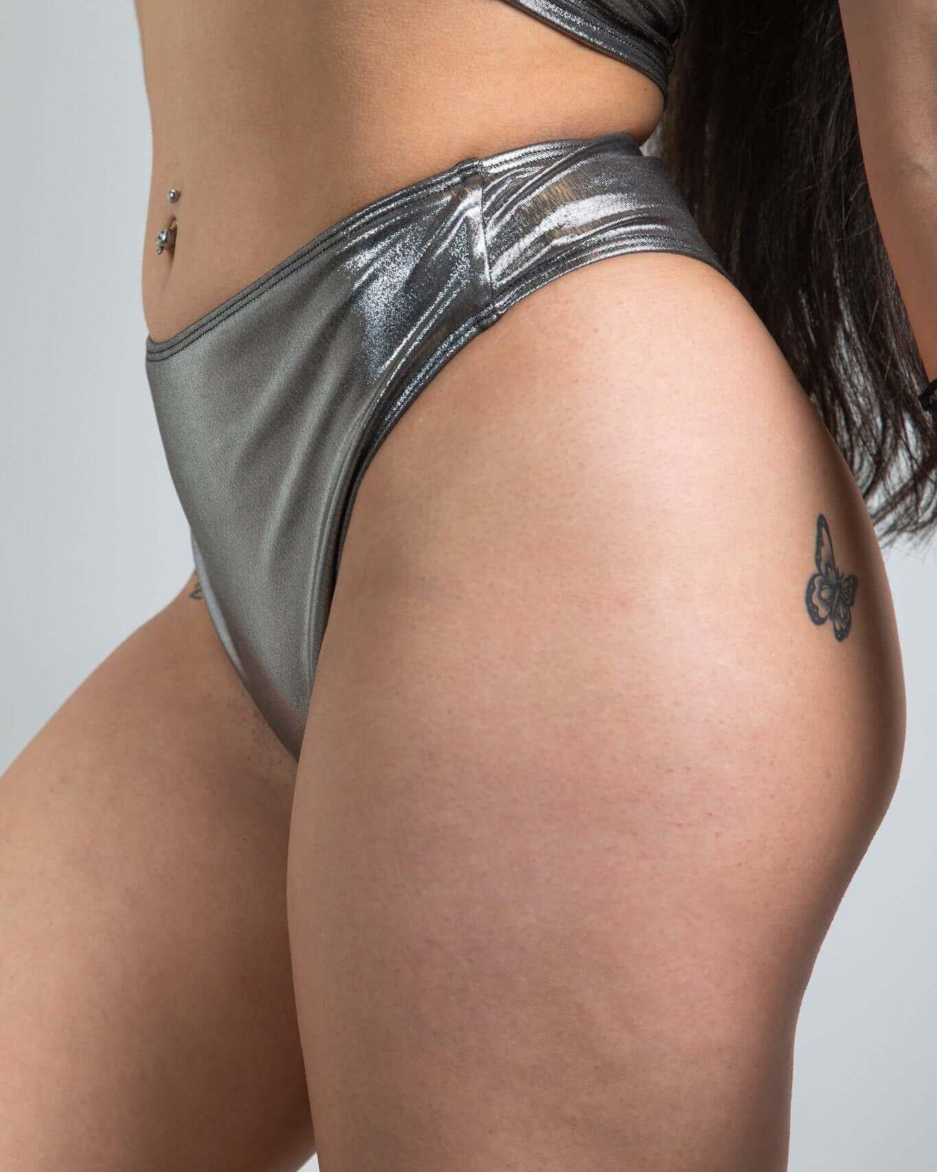 Chrome high waisted thong featuring a shiny metallic finish, perfect for rave outfits and designed for comfort and style.