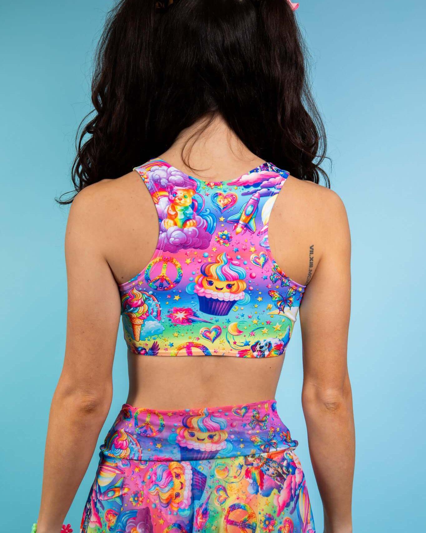 Model wearing the colorful Kosmic Keyhole Top featuring a playful design, ideal for rave outfits, with a racer back style.