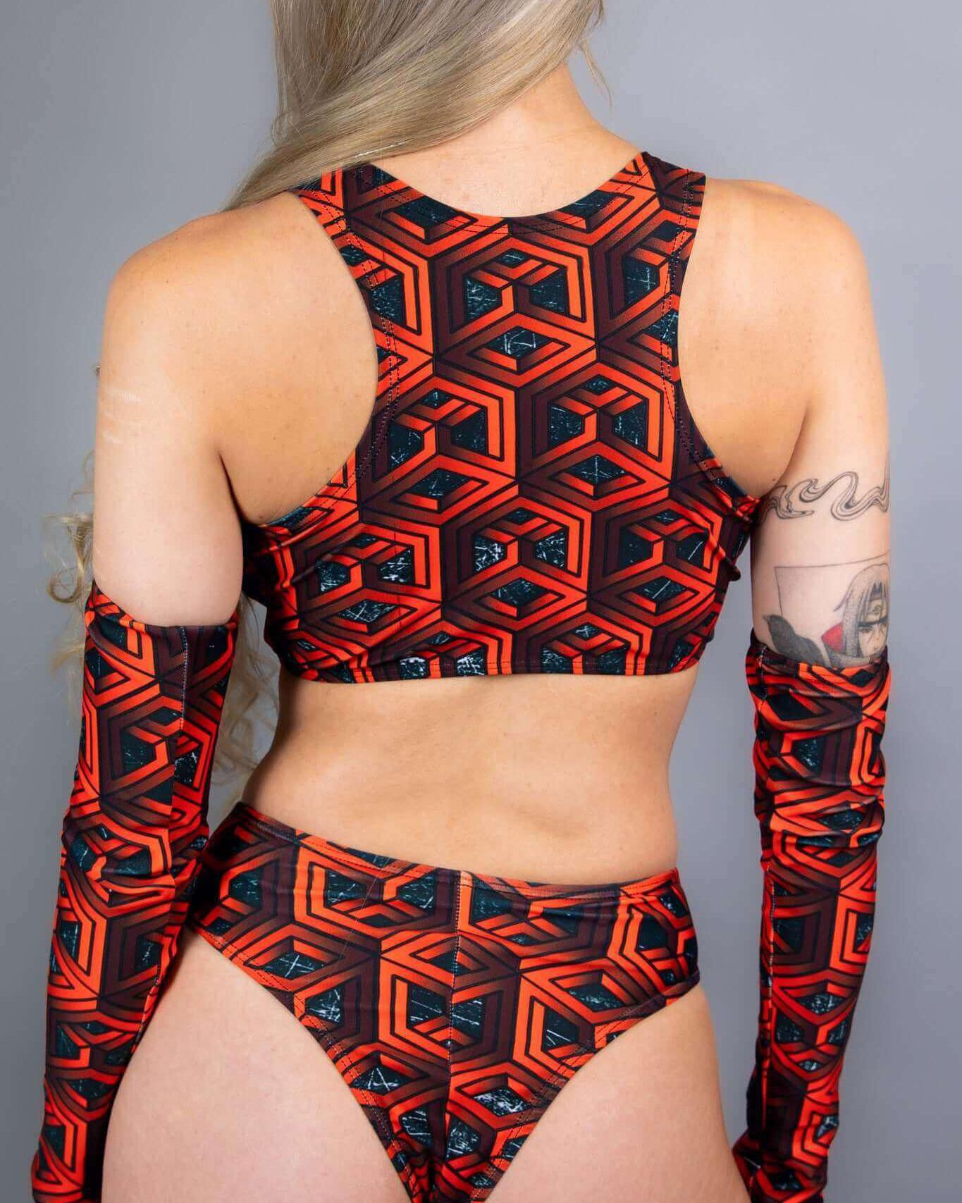 Red and black geometric Keyhole Top and matching bottoms, perfect for rave outfits and stylish summer events.