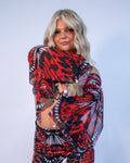 Lacewing Metamorphosis Sleeves in red and black butterfly print, worn by a model posing frontally, perfect for a rave festival look.