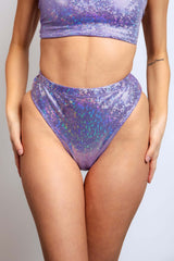 Front profile of a model wearing a glittery lavender high-waist bottom from Freedom Rave Wear.