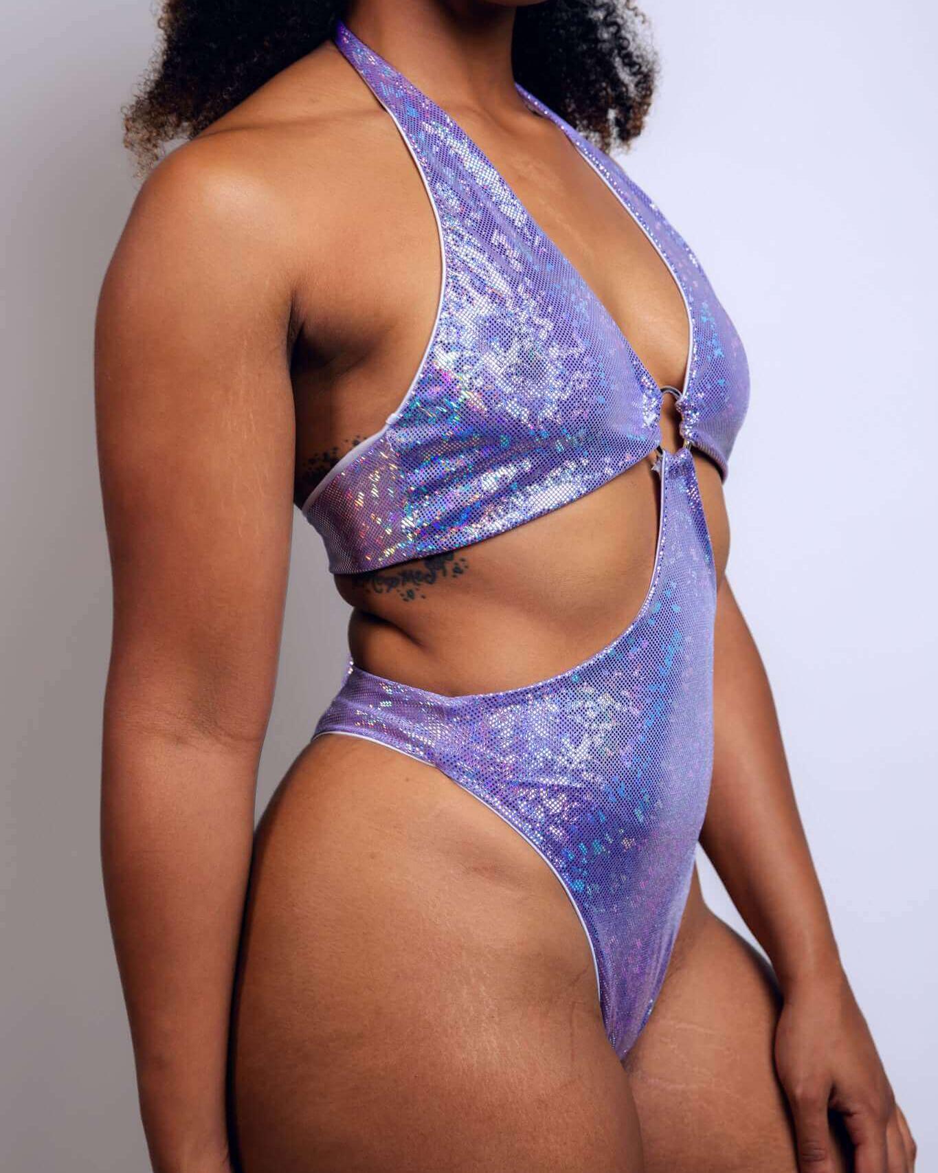 Lavender Holo O-Ring Bodysuit showcasing unique cutouts and sparkly design, perfect for rave outfits.