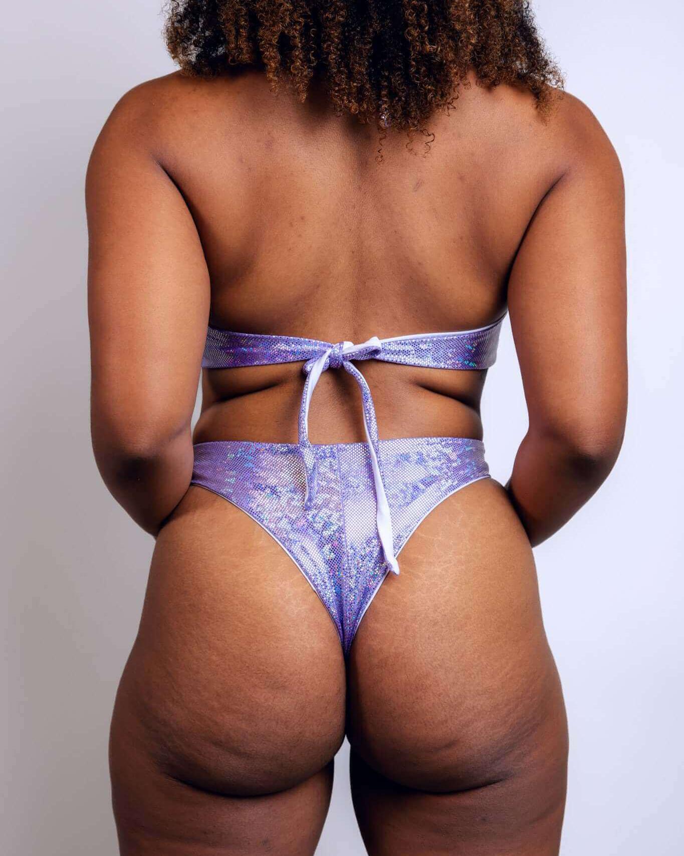 Back view of a sparkly lavender bikini with tie details, perfect for beach outings and summertime fun.