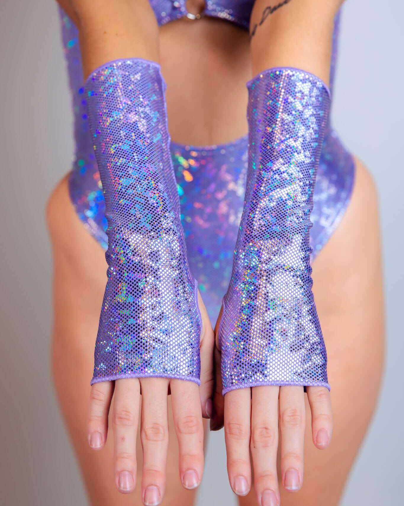 Sparkly lavender holo gloves for rave outfits, featuring thumb holes and a comfortable forearm design.