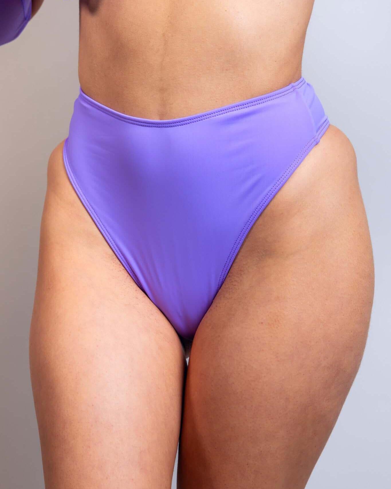 Lavender high-waisted thong showcasing a stylish design, perfect for rave outfits, with a soft, stretchy fit.