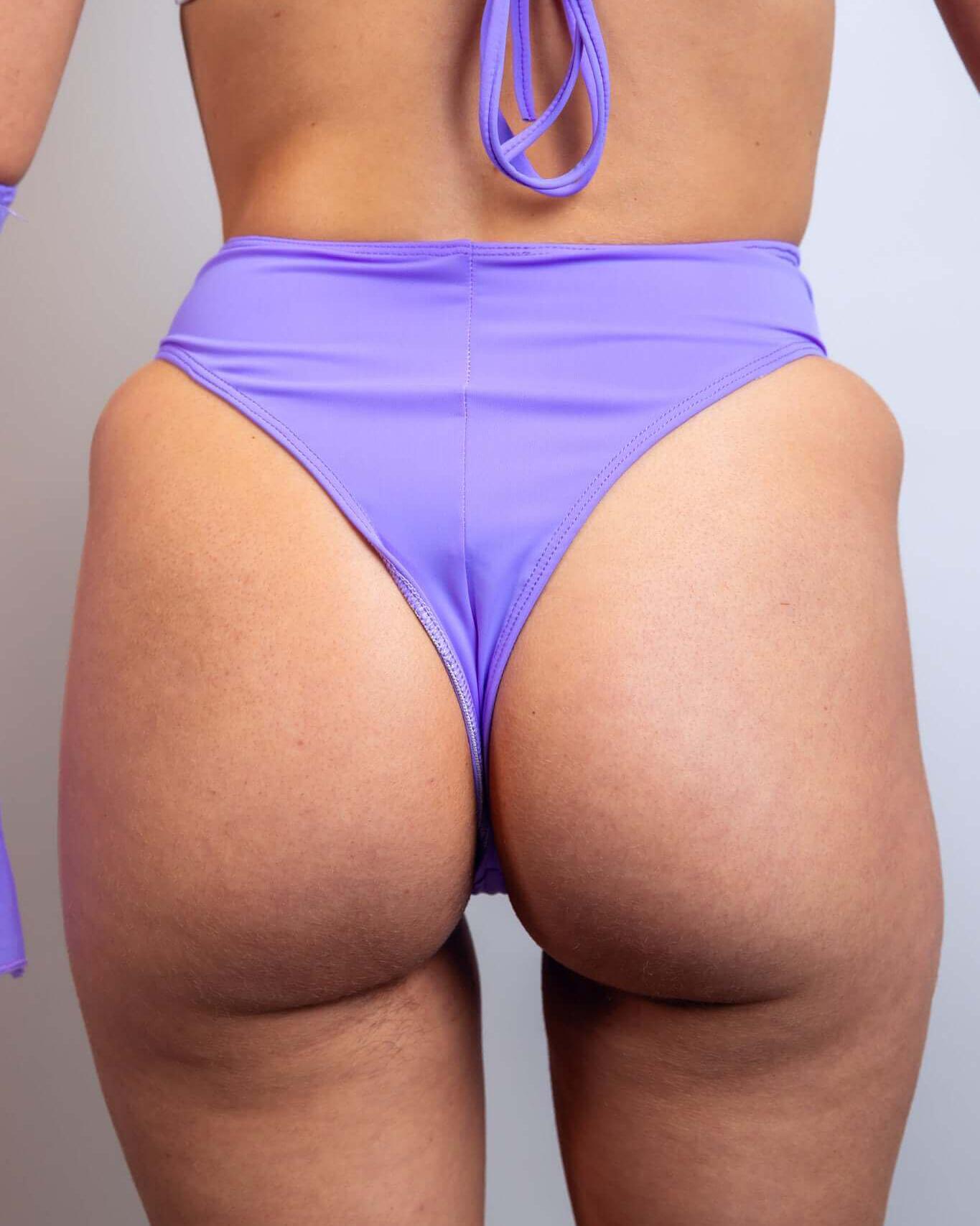 Lavender high-waisted thong showcasing a stylish fit, perfect for rave outfits and dancing the night away.