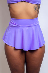 Lavender rave micro skater skirt from Freedom Rave Wear, featuring a high-waisted fit and flared silhouette, perfect for festival fashion