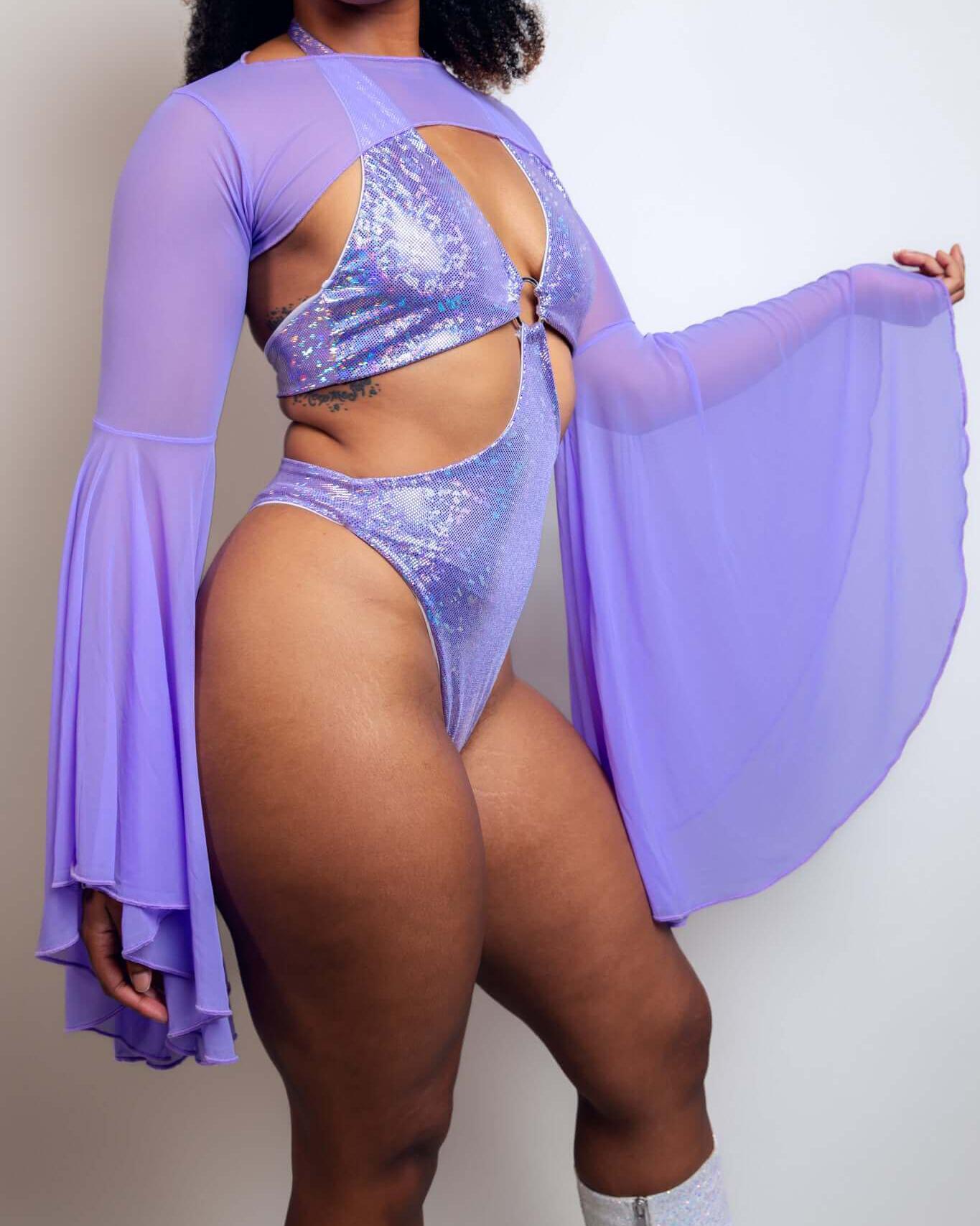 Lavender mesh bell sleeves paired with a glittery bodysuit for a stylish rave outfit look. Perfect for ethereal vibes.