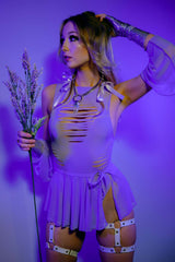 Lavender cutout bodysuit with ribbon ties and shimmering arm pieces, accessorized with silver garters, part of the Freedom Rave Wear collection.