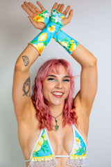 Lemon Drop Gloves showcased by a smiling model, perfect for rave outfits with a colorful floral design.