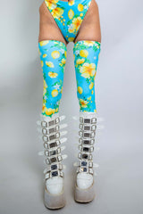 Lemon Drop Leg Sleeves in vibrant blue with lemon print, styled with chunky white platform boots for rave outfits.