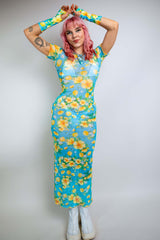 Model wearing a lemon drop mesh maxi dress with floral print, ideal for summer rave outfits and nightlife events.