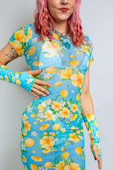 Model wearing Lemon Drop Mesh Baby Tee Maxi Dress with floral print, perfect for rave outfits and summer events.