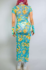 Model showcasing the Lemon Drop Mesh Baby Tee Maxi Dress with floral print, perfect for rave outfits and summer events.