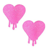 Light pink glitter melty heart nipple cover pasties for rave outfits and fun fashion emergencies.