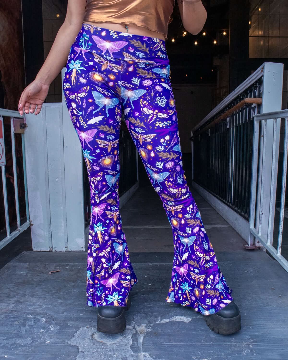 Lucent Bell Bottoms in a vibrant bioluminescent print, perfect for stylish rave outfits and bold fashion statements.