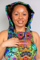 Portrait of a model wearing a Freedom Rave Wear hood with bodysuit, featuring vibrant, psychedelic patterns in rich colors