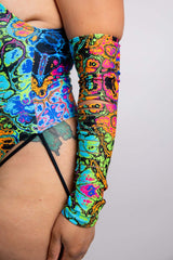 Close-up of a Freedom Rave Wear slit arm sleeve, displaying vibrant, multicolored psychedelic patterns and intricate details.