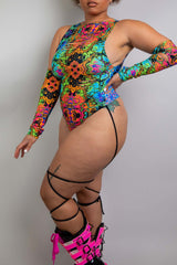 Dynamic profile shot of a Freedom Rave Wear bodysuit, displaying vibrant, detailed psychedelic patterns and arm cutouts, accessorized with striking boots
