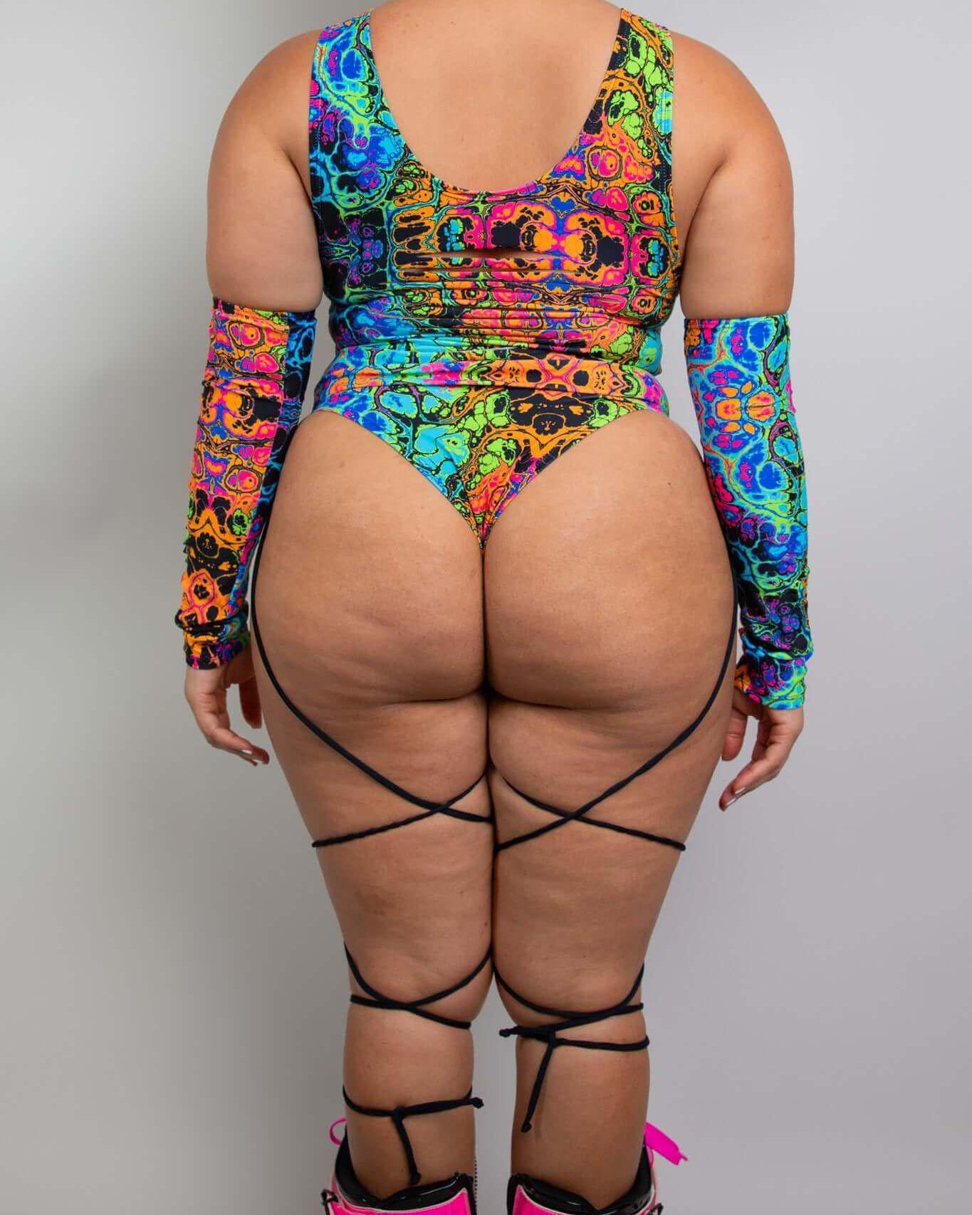 Colorful psychedelic bodysuit with sideboob and leg straps, perfect for rave outfits.