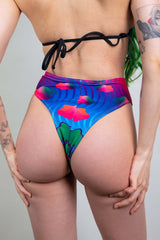 Freedom Rave Wear's high-waist thong features vibrant psychedelic patterns, ideal for standout rave style.