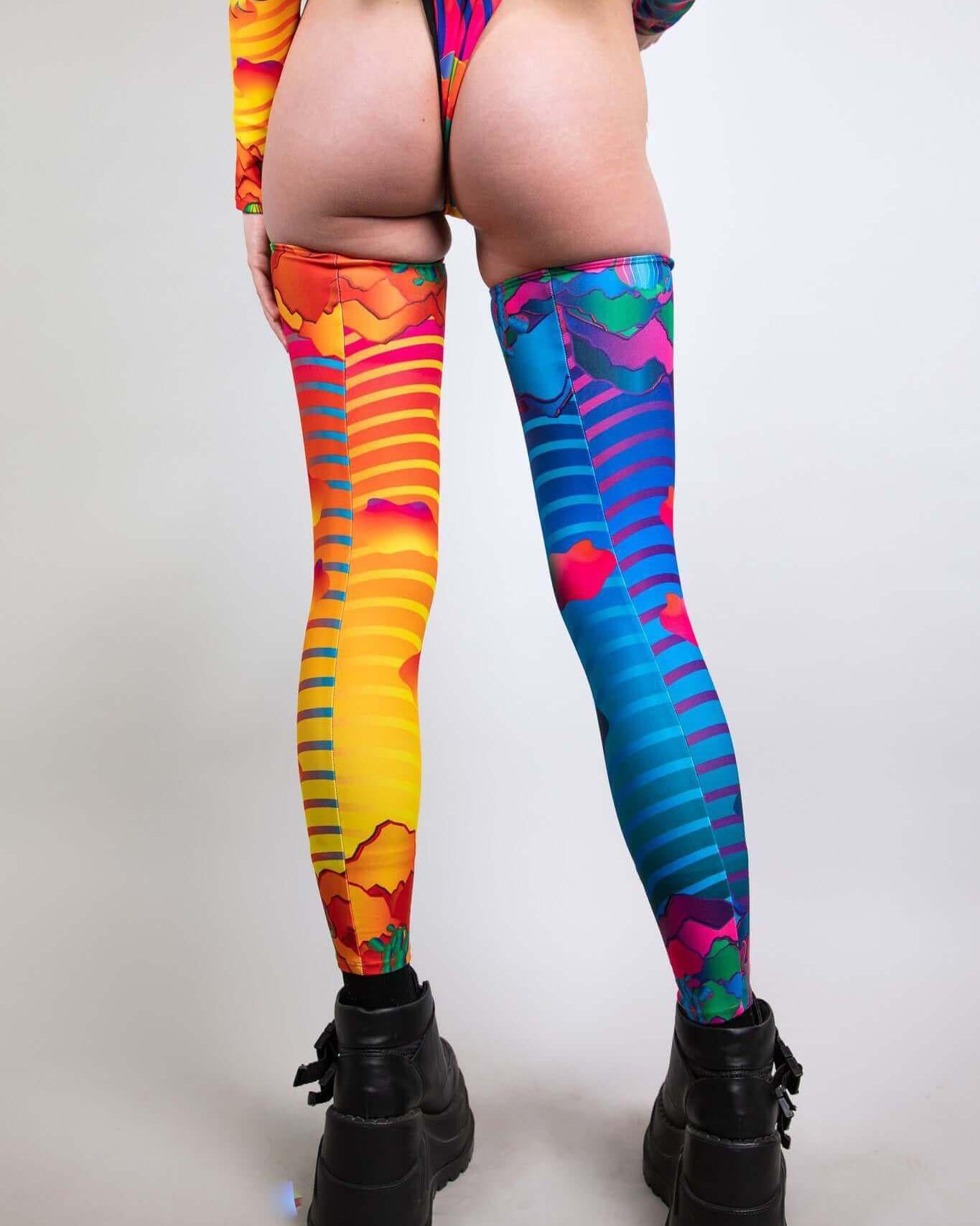 Colorful Mirage Leg Sleeves in vibrant designs, perfect for rave outfits and festival fashion.