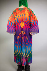 Back view of a Freedom Rave Wear robe with vivid sun and waves design, showcasing a colorful, airy silhouette