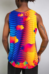 Rear view of a man wearing a colorful Freedom Rave Wear tank top, showcasing vibrant, psychedelic patterns.
