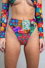 An up close photo of a girl wearing a high waisted rainbow patchwork bikini bottom with a matching crop top.