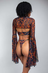 Freedom Rave Wear lava print rave bikini with sheer bell-sleeve top. The back view highlights the unique fiery design, perfect for festivals.