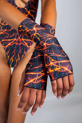 Magma Gloves on model, featuring fiery design perfect for rave outfits, showcasing thumb holes and forearm coverage.