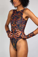 Model showcasing the Magma High Neck Bodysuit with fiery design, perfect for rave outfits and dancing.