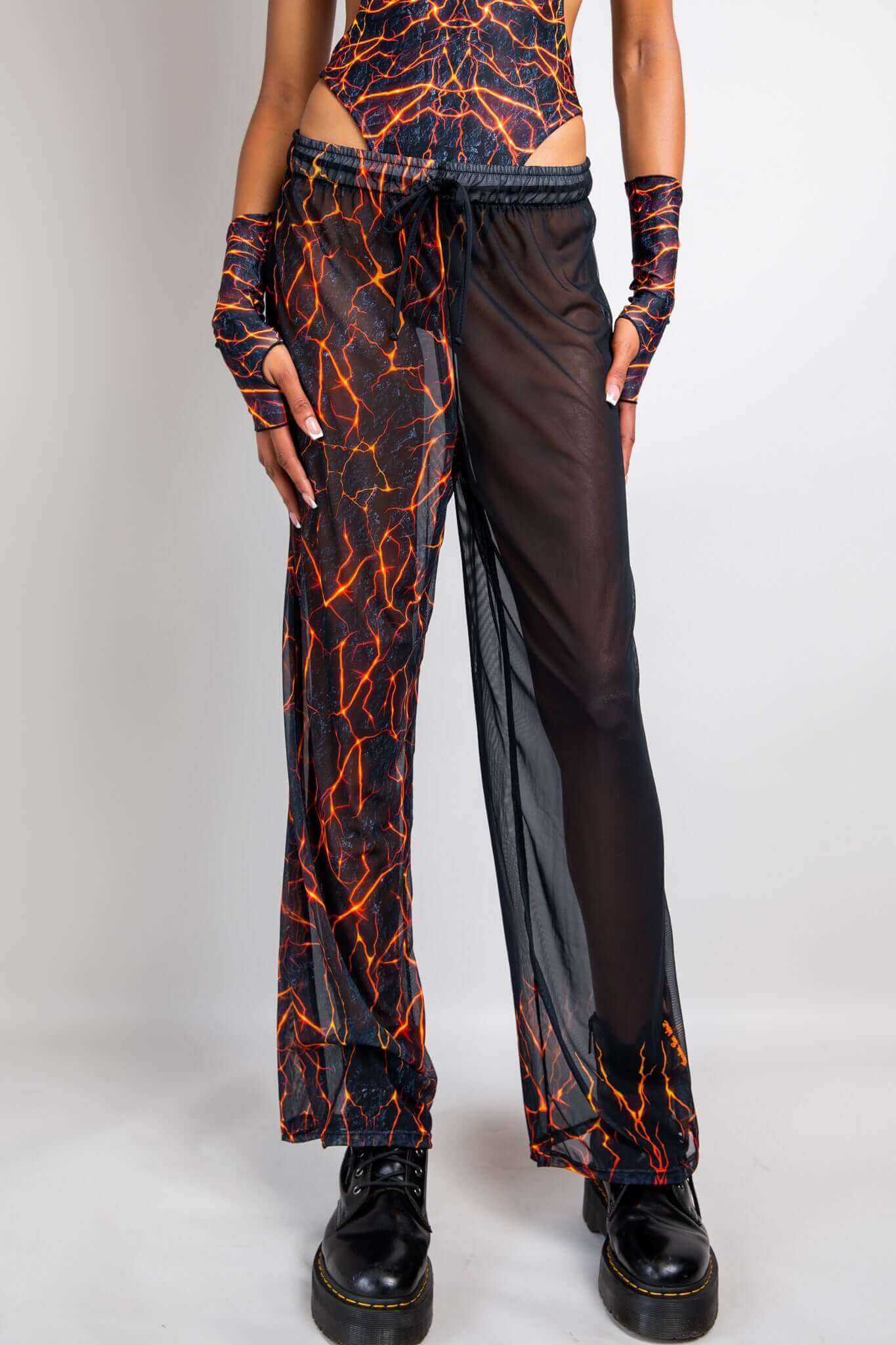 Freedom Rave Wear lava print sheer pants with slits and matching accessories. Perfect for adding a dramatic flair to your rave outfit.