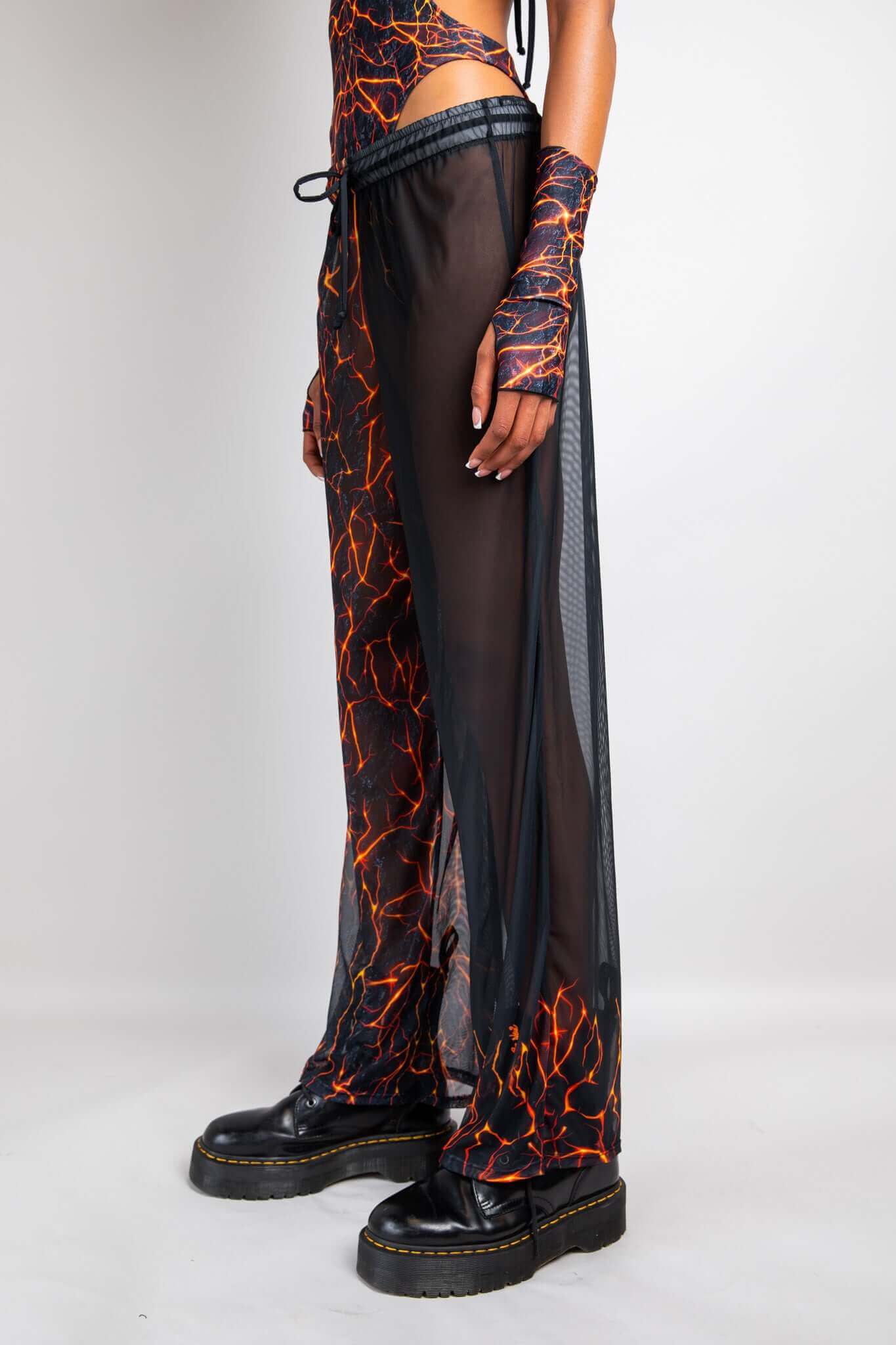 Freedom Rave Wear lava print sheer pants with side slits and matching arm sleeves. Bold and unique, perfect for standout rave looks.