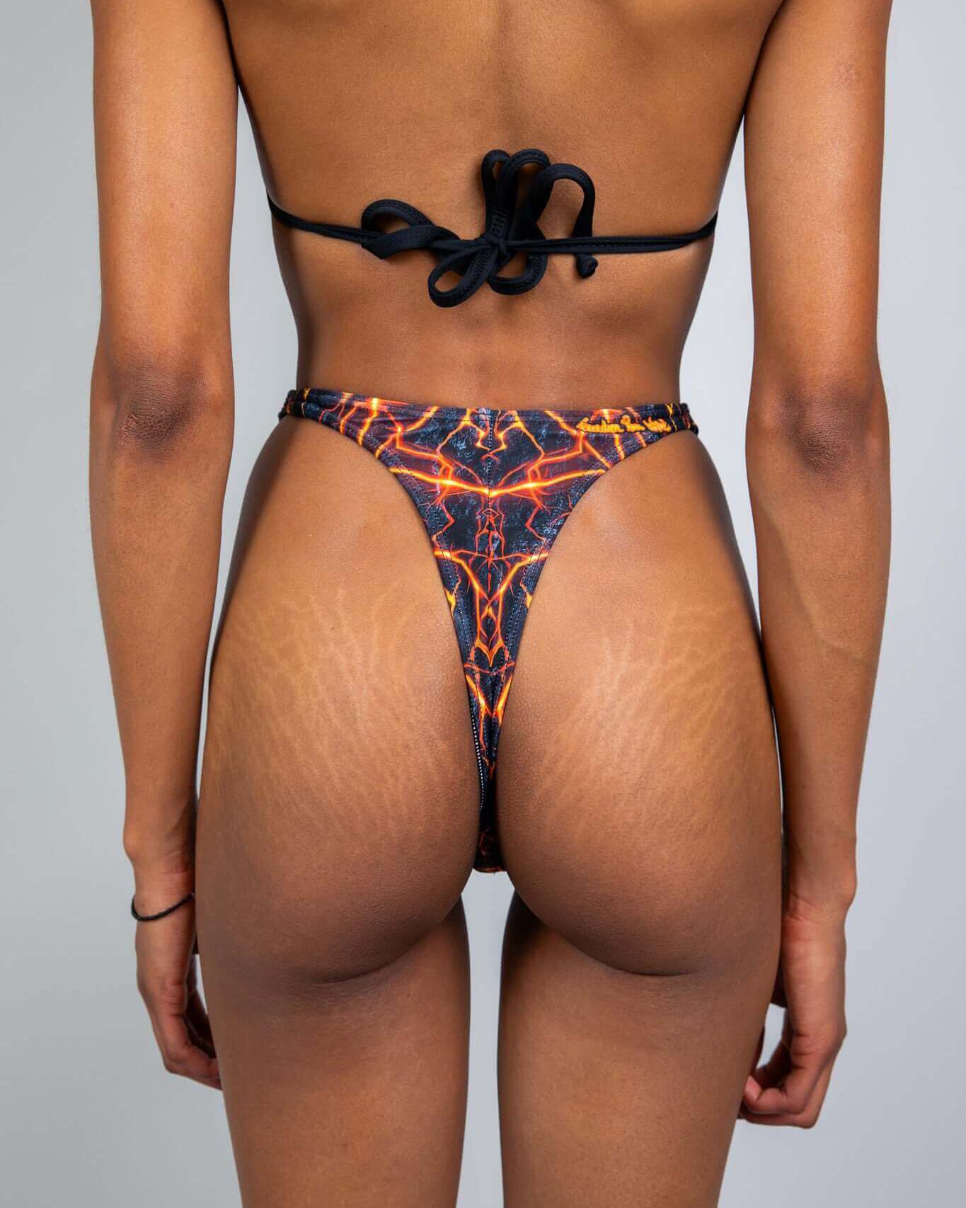 Magma Retro Thong Bottoms featuring vibrant lava print, perfect for rave outfits and showcasing a bold, sexy style.