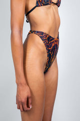 Magma Retro Thong Bottoms showcasing vibrant lava rave print, perfect for trendy rave outfits.